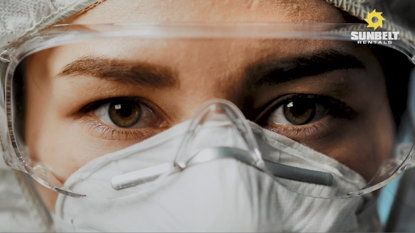 Women Wearing Face Mask And Goggles, While Taking Part In A Face Fit Test