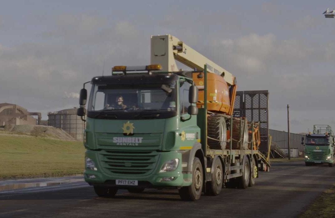 Sunbelt Truck Carrying Powered Access Boom To Site